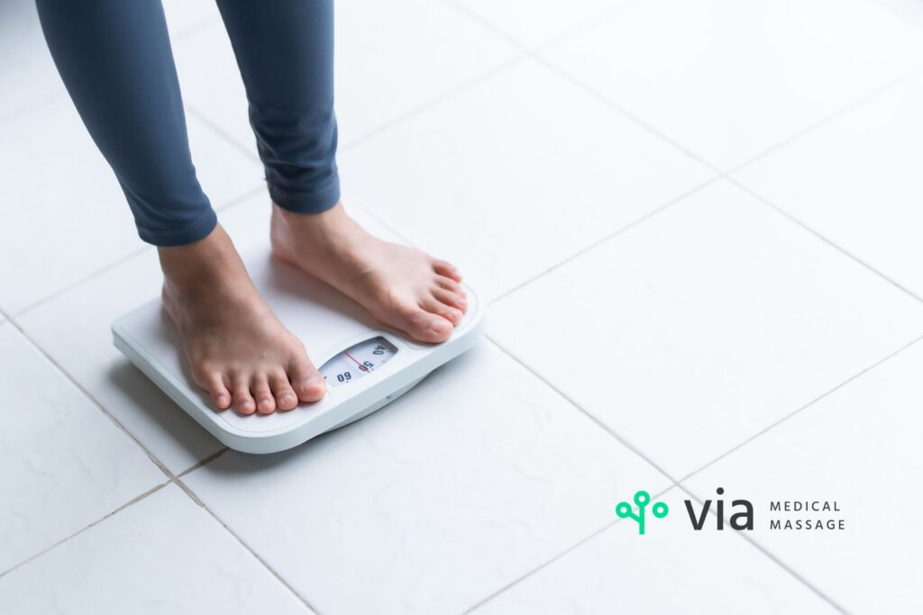 woman standing on scale