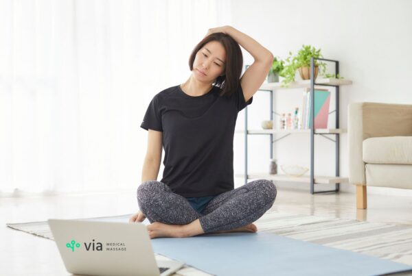crunchy muscles neck roll woman sitting on grund stretching neck