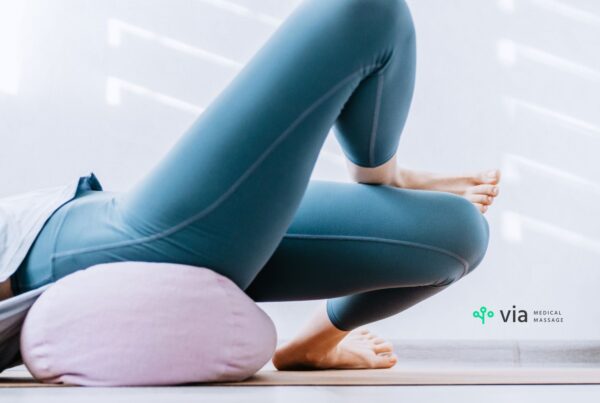 Hip stretching figure four legs and pillow