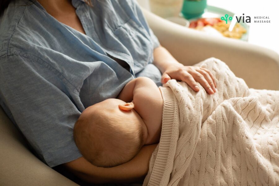 woman breastfeeding a newborn baby